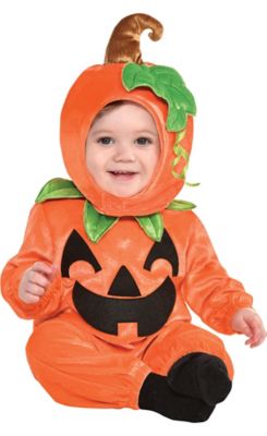 baby in a pumpkin costume